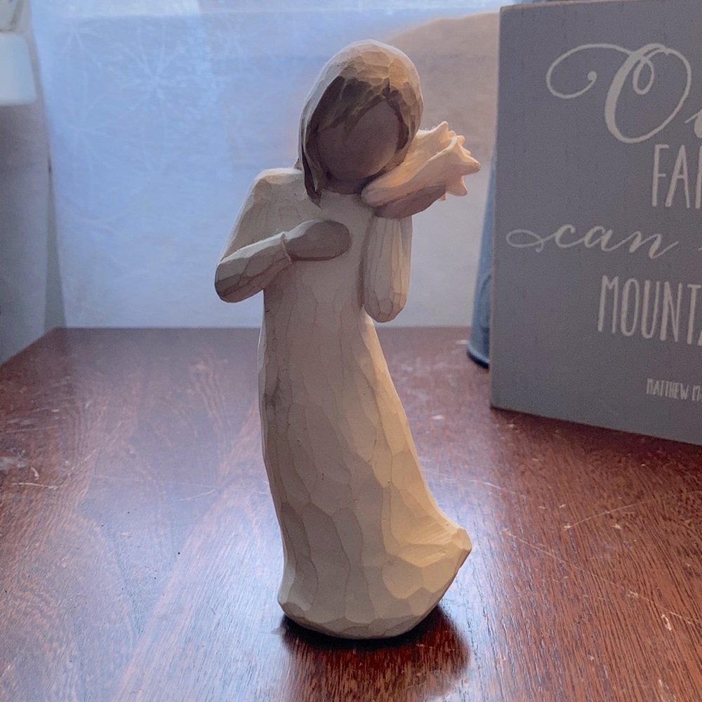 Willow tree girl holding seashell